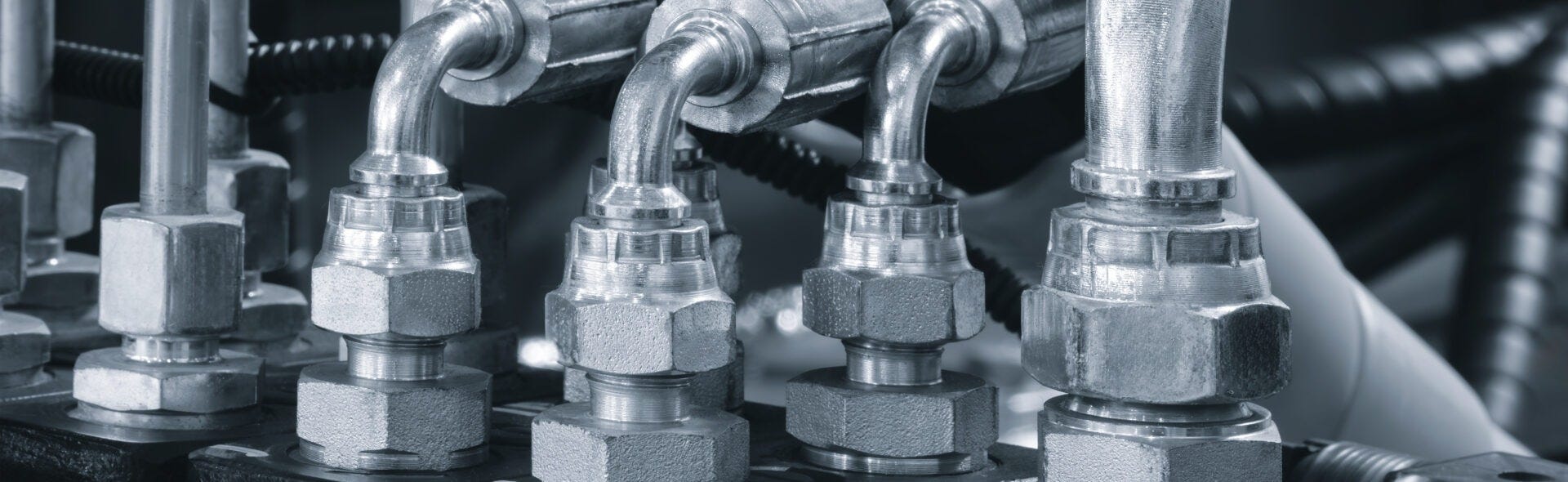 hydraulic hoses with fittings and ferrules on a machine